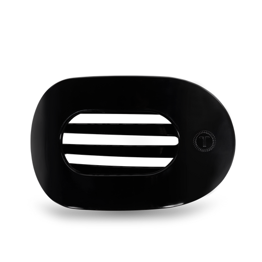 Black teleties round hair clip on a white background