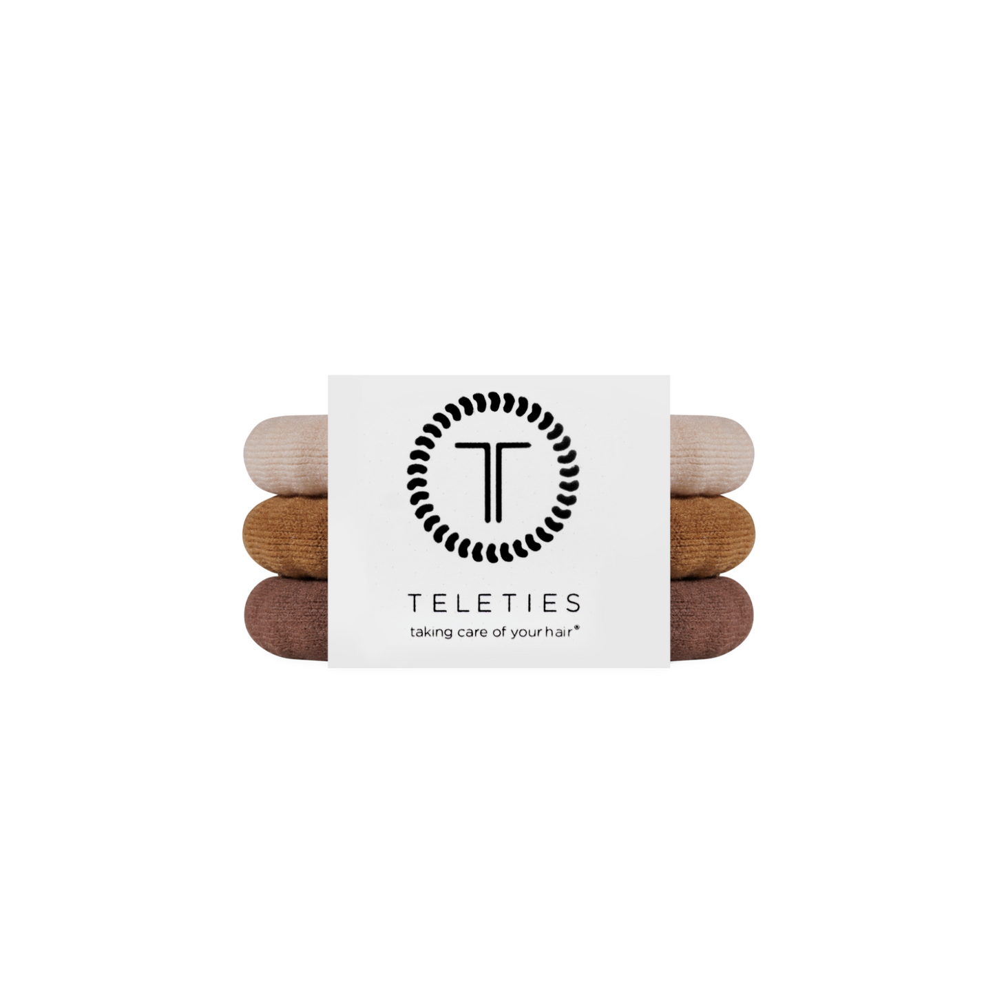 Stack of hair ties with a Teleties branded card on a white background