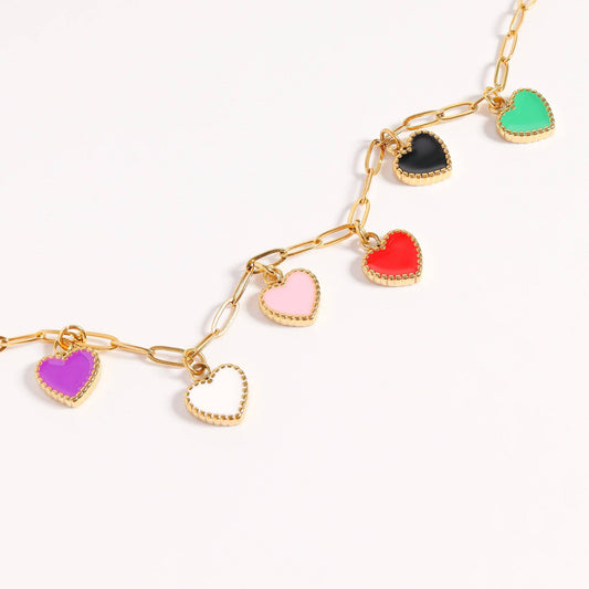 Gold chain necklace with colorful heart-shaped pendants on a white background