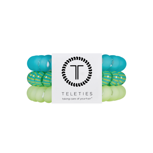 Set of green and blue hair ties with Teleties branding on a white background