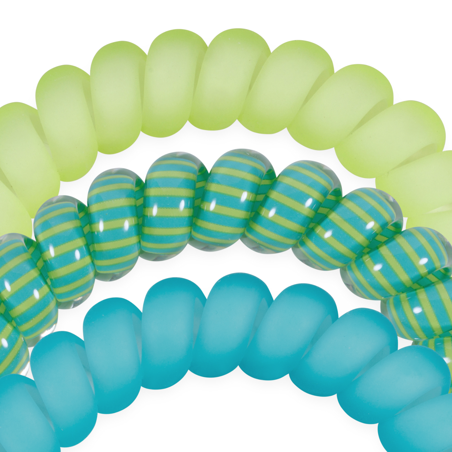 Close-up of green, blue, and striped rubber hair tie bands on a white background