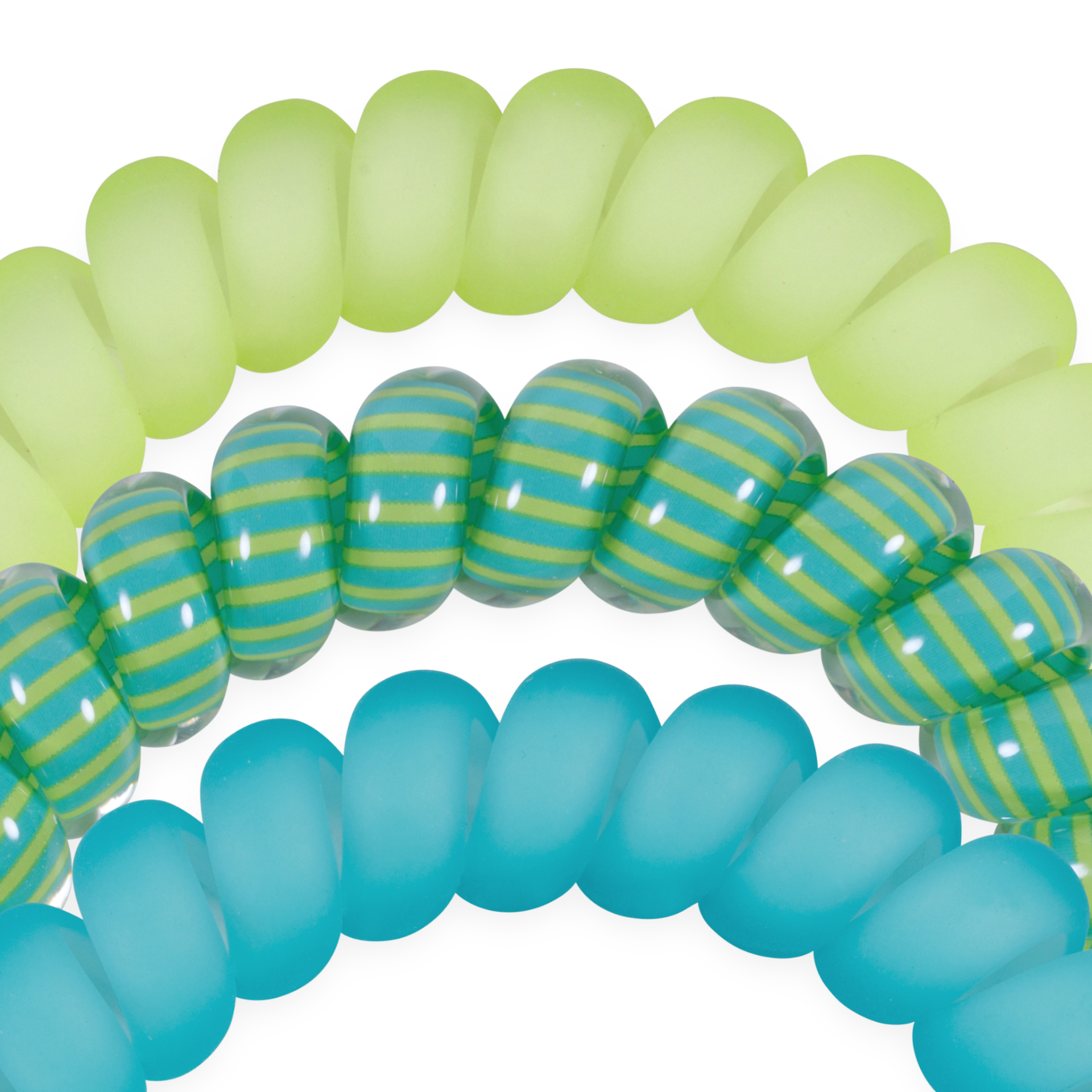 Close-up of green, blue, and striped rubber hair tie bands on a white background