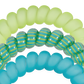 Close-up of green, blue, and striped rubber hair tie bands on a white background