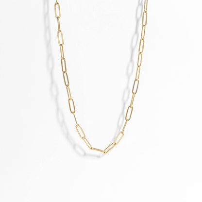 Gold chain necklace on a white background