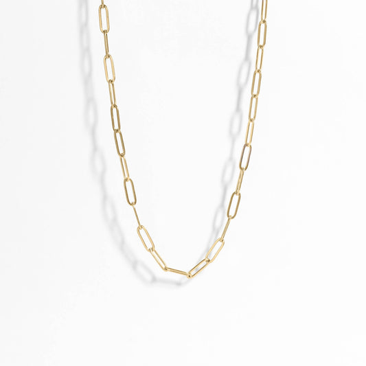 Gold chain necklace on a white background