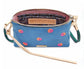 Blue handbag with floral embroidery Consuela branding on a white background
