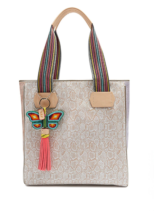 Consuela cream tote bag with colorful woven straps and butterfly charm