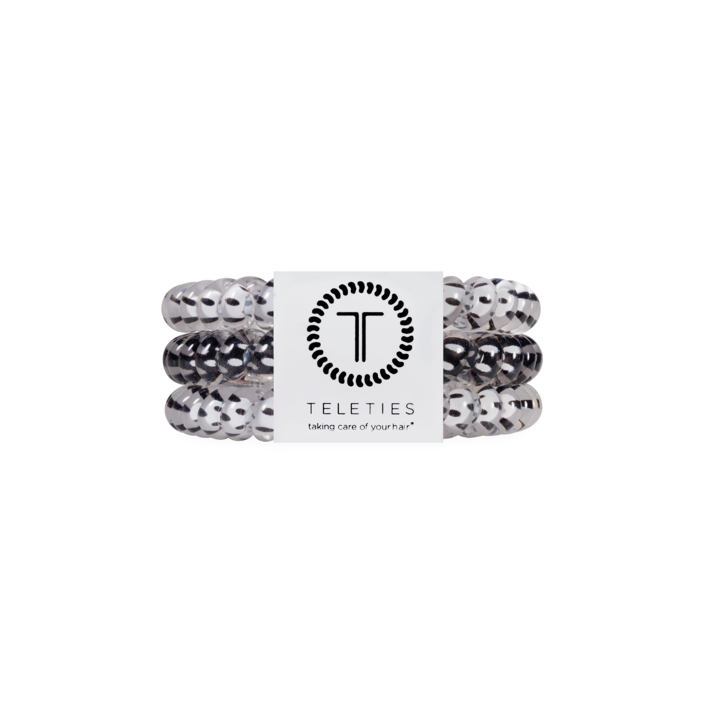 Set of white and black hair ties with a Teleties label on a white background