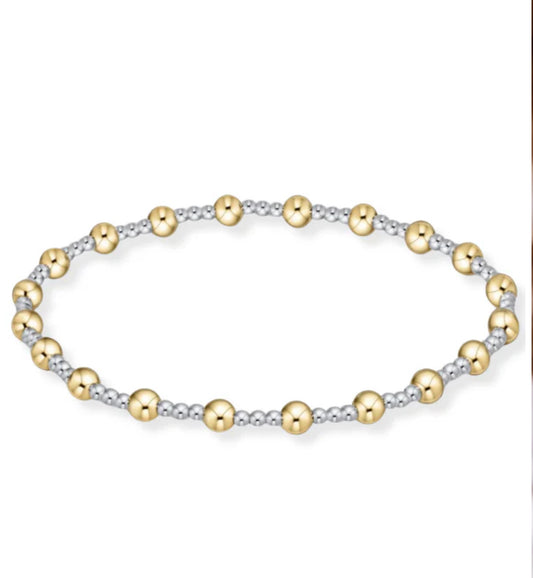 enewton bracelet with mixed metal beads, featuring sterling silver beads and gold-filled beads, hand beaded on elastic.