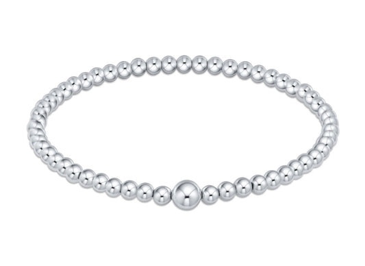 Sterling silver beaded bangle on a white background
