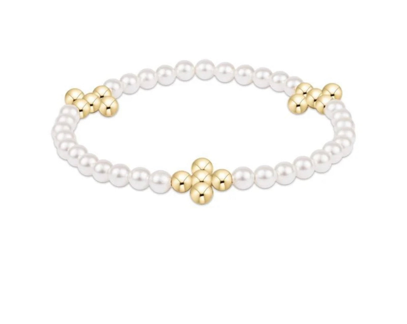 Pearl bracelet with gold beaded cross on a white background