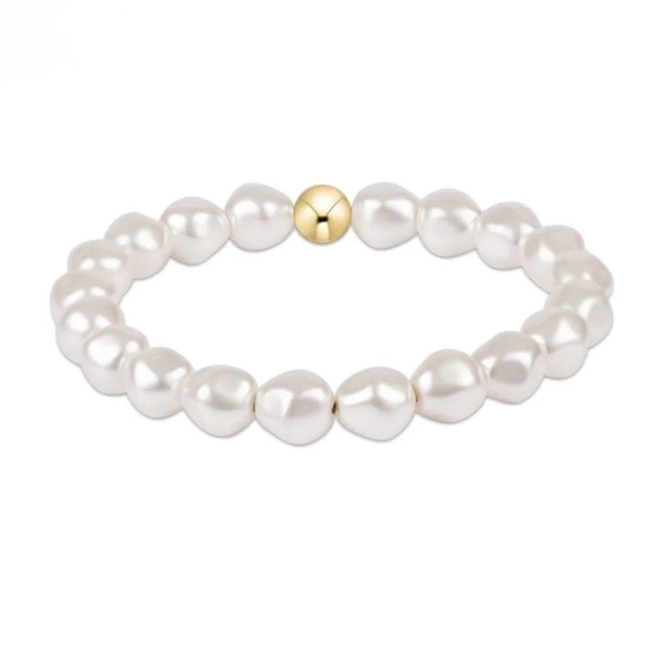 Pearl bracelet with a gold  on a white background
