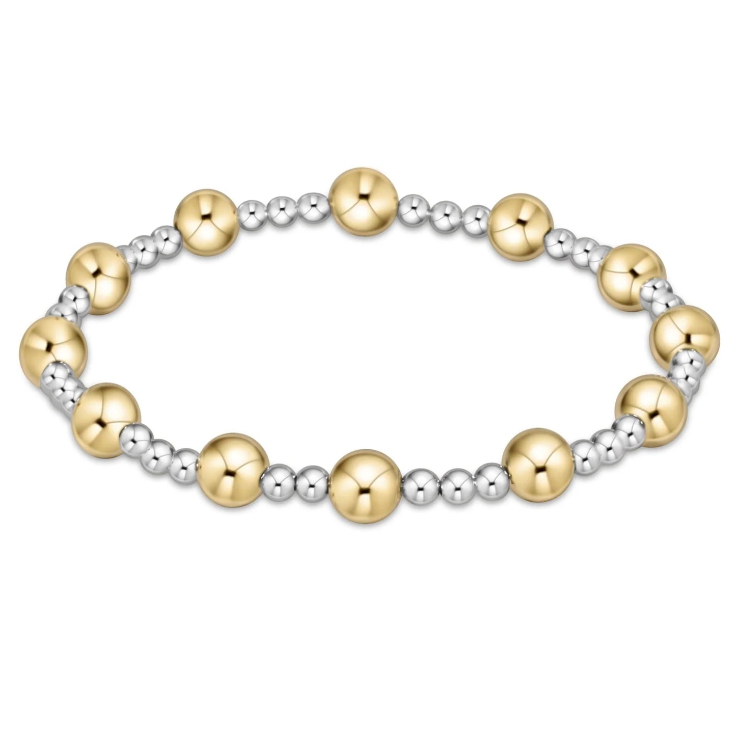 Bracelet with gold and sterling silver beads on a white background