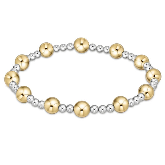 Bracelet with gold and sterling silver beads on a white background