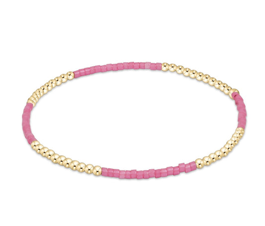 Enewton old and pink beaded bracelet on a white background