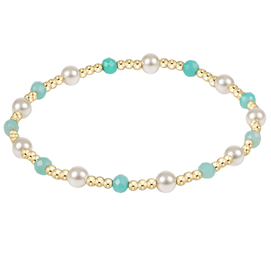 Bracelet with pearls and turquoise beads on a white background