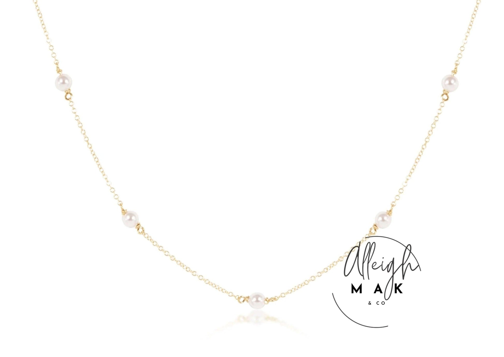 a gold-colored choker necklace with 4mm pearl accents, branded by Enewton, displayed on a white background.