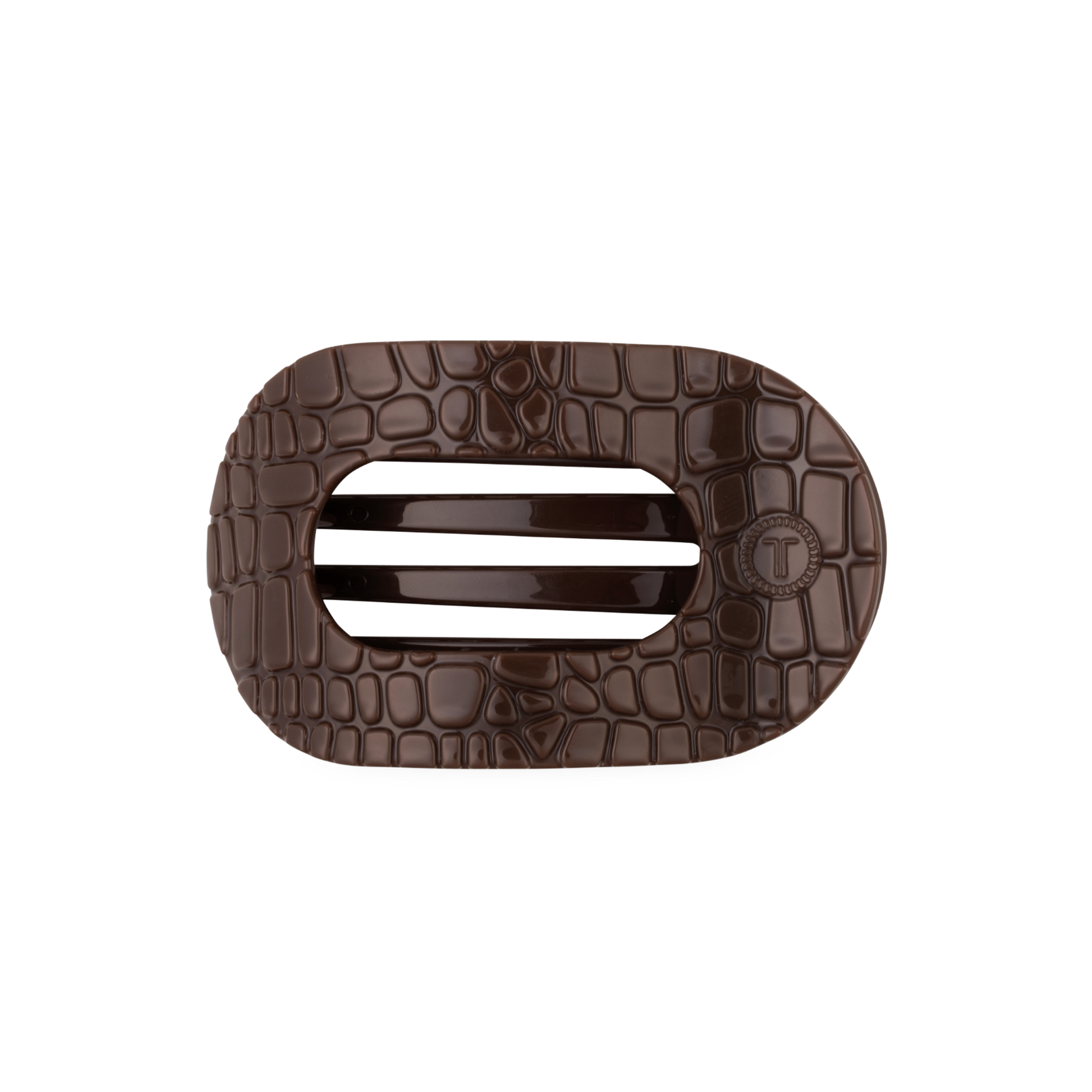 Brown crocodile-patterned hair clip with on a white background