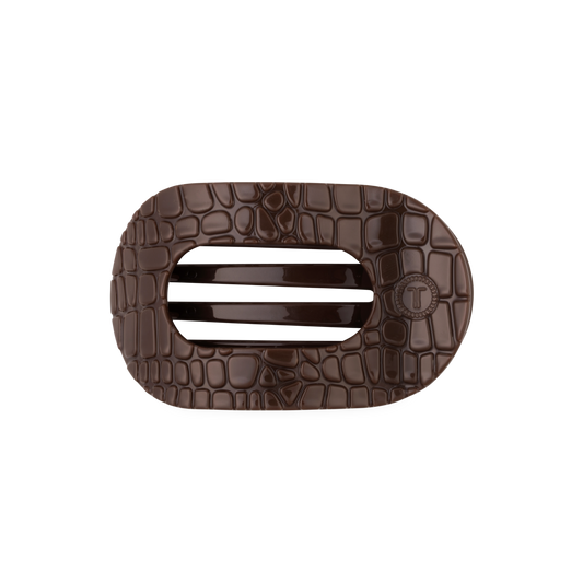 Brown crocodile-patterned hair clip with on a white background