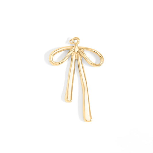 Gold bow-shaped pendant on a white background