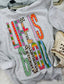 Gray sweatshirt with 'Life is Good' text in colorful patterns on a white surface.