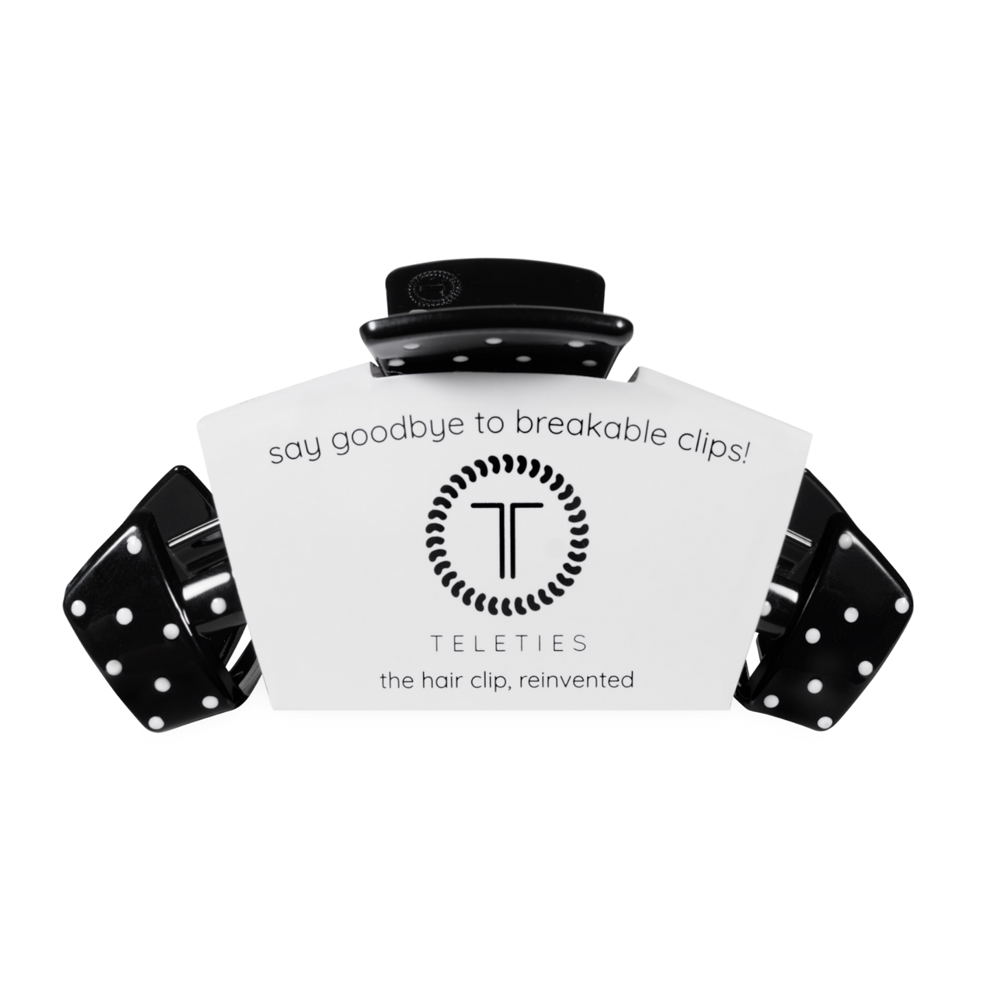 Black hair clip with white label displaying 'Teleties' on a white background