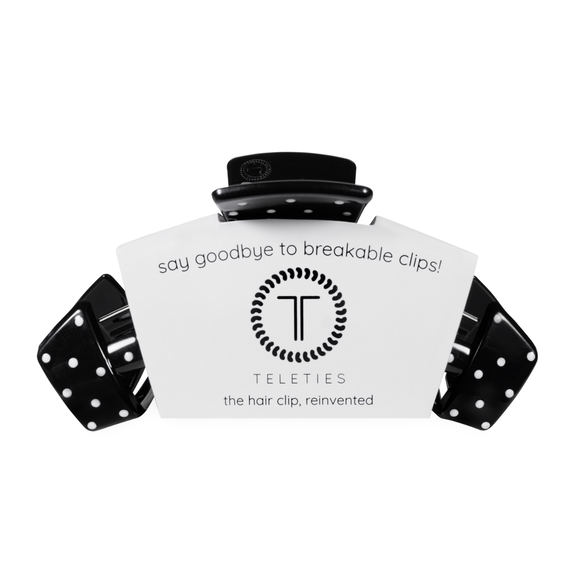 Black hair clip with white label displaying 'Teleties' on a white background
