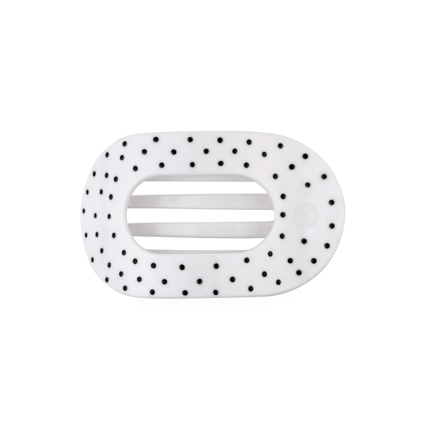White hair clip with black polka dots on a white background