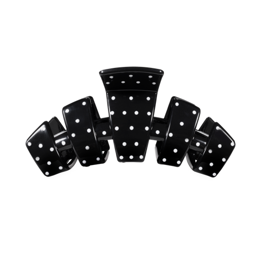 Hair clip black with white dots on a white background 