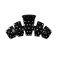 Hair clip black with white dots on a white background 