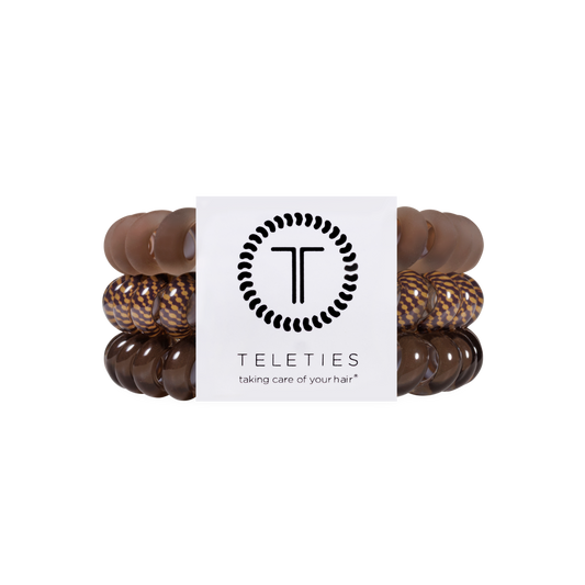 Set of brown hair ties with a white label displaying 'Teleties' brand on a white background.