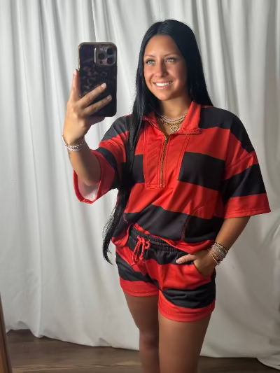Women's red and black striped half zip short sleeve top and matching drawstring shorts set