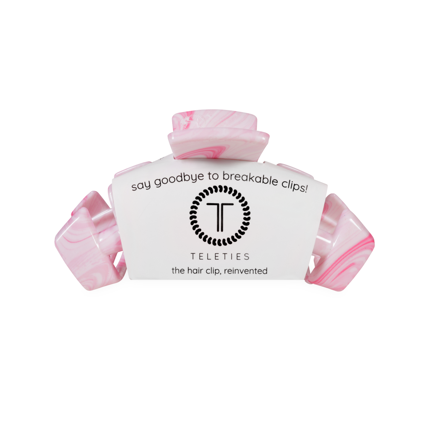 Pink hair clip with teleties white label on a white background