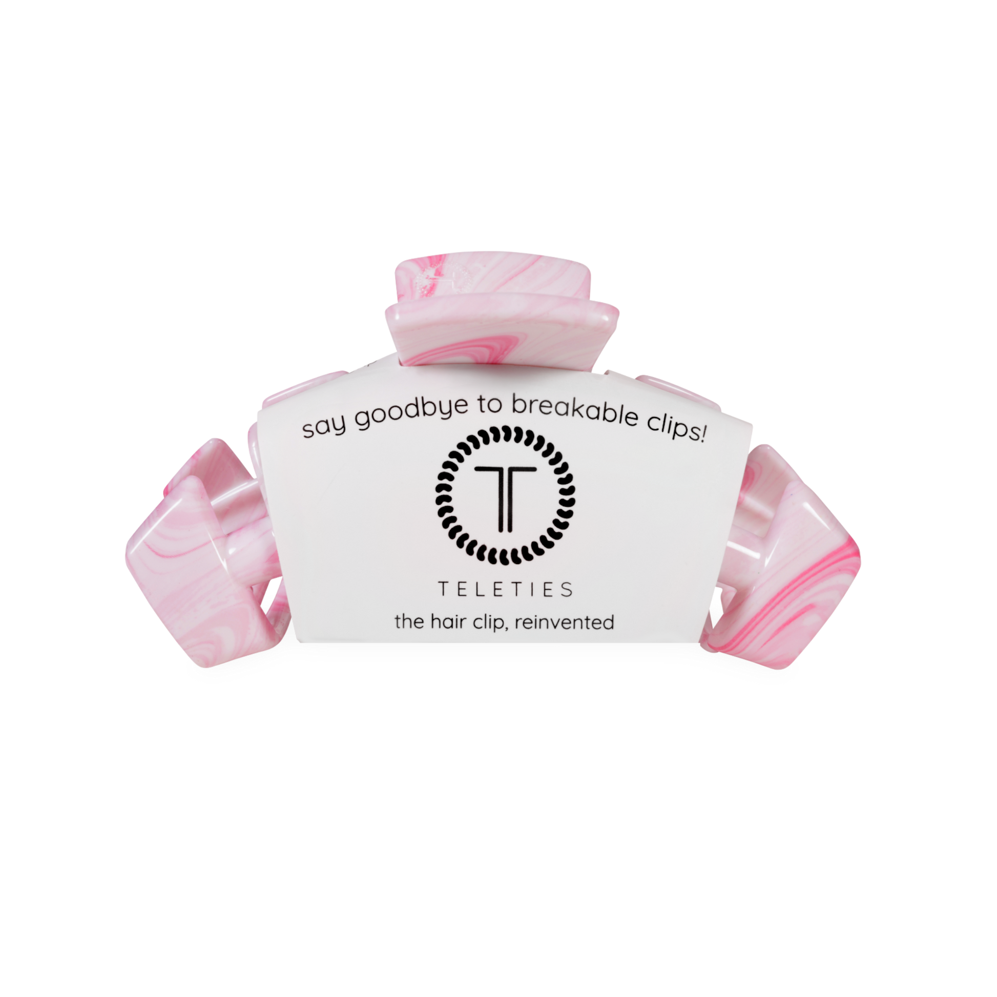 Pink hair clip with teleties white label on a white background