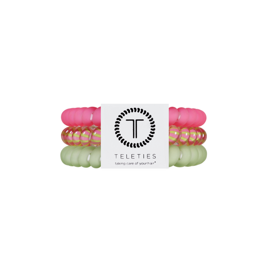 Set of colorful hair ties with a Teleties branded label on a white background