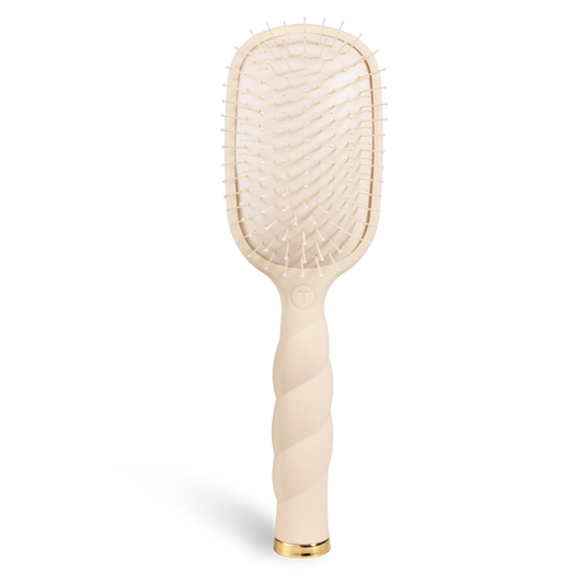 Tan teleties brush on a white background