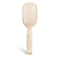 Tan teleties brush on a white background