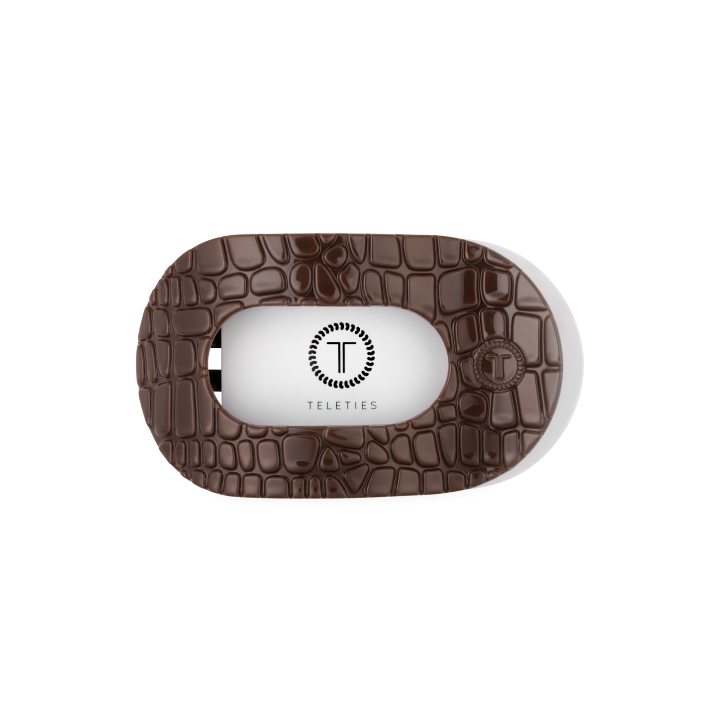 Brown textured case with a white interior for a product, featuring the brand 'Teleties'.