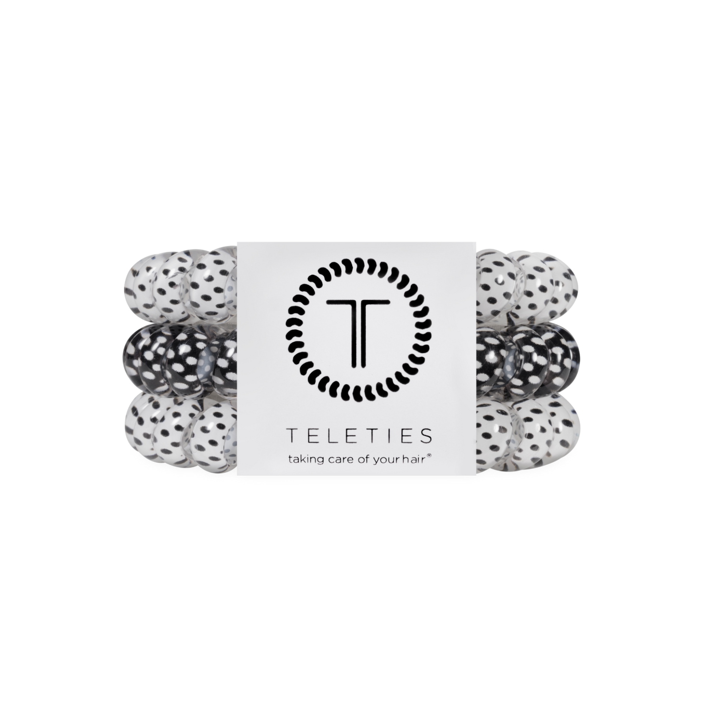 Set of black and white polka dot hair ties with a Teleties branded label on a white background