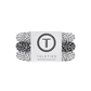 Set of black and white polka dot hair ties with a Teleties branded label on a white background