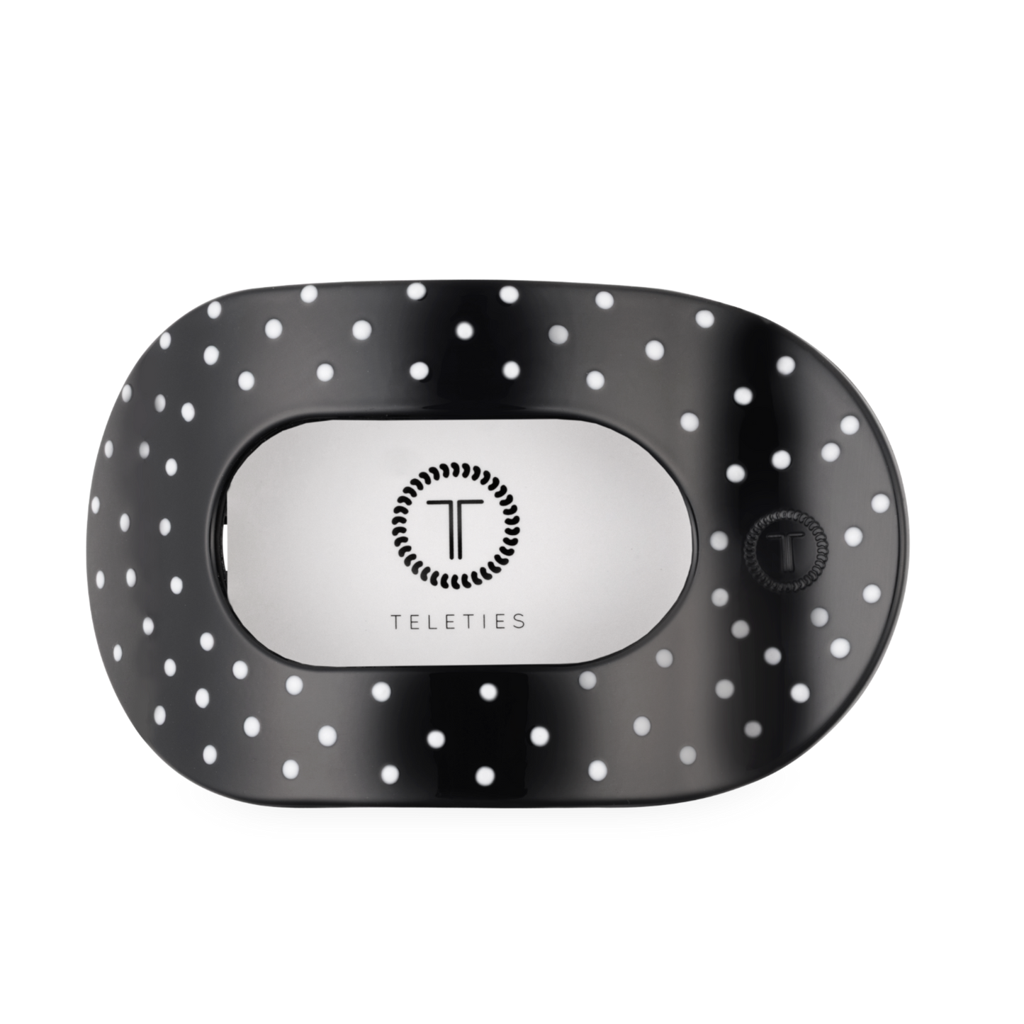 Black and white polka dot hair clip with 'Teleties' branding on a white background