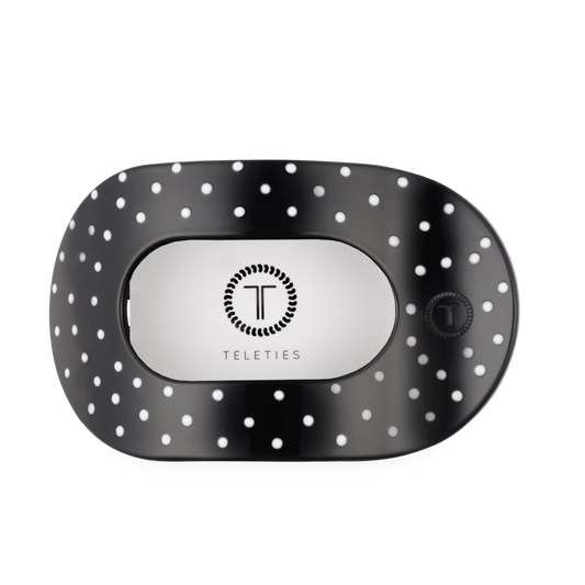 Black and white polka dot hair clip with 'Teleties' branding on a white background