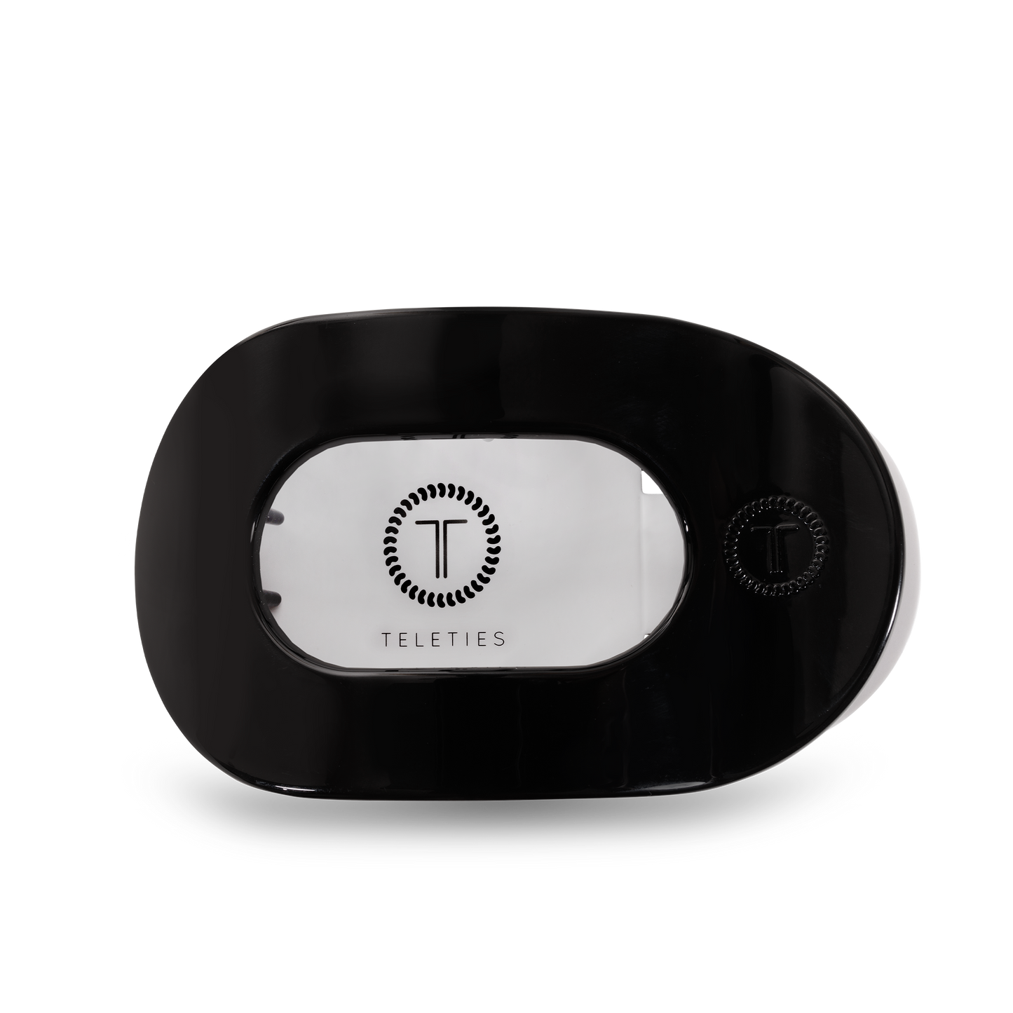 Black hair clip with 'Teleties' branding on a white background