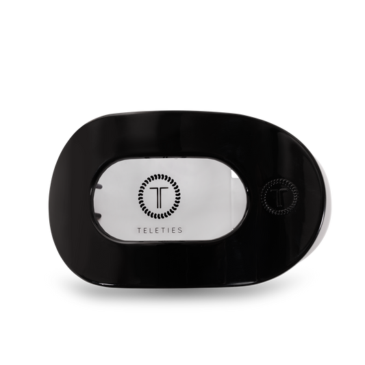 Black hair clip with 'Teleties' branding on a white background