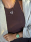 Gold heart pendant necklace with crystal accents on a delicate chain