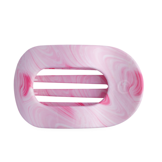 Pink and white marbled hair clip on a white background