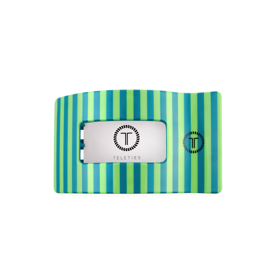 Striped hair clip with a brand label on a white background