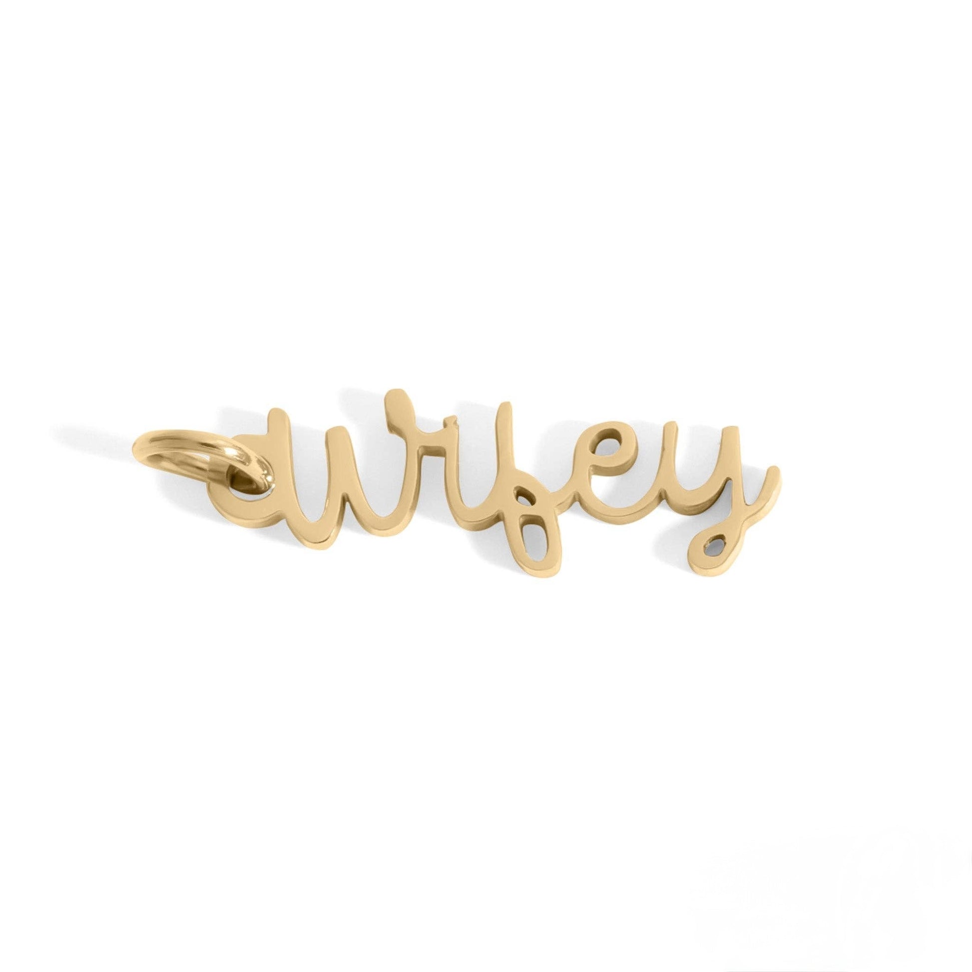 Gold 'wifey' pendant on a white background