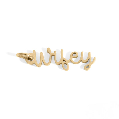 Gold 'wifey' pendant on a white background