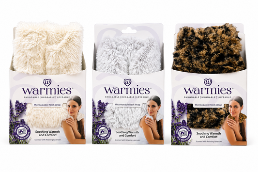 Three packages of Warmies microwavable hand warmers with different colored covers.